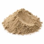 Illustrative close-up of aniseed powder texture on a white background